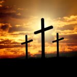 Three crosses in sunset