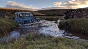Land Rover fording a river
