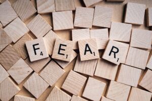 The word fear spelt out in scrabble blocks