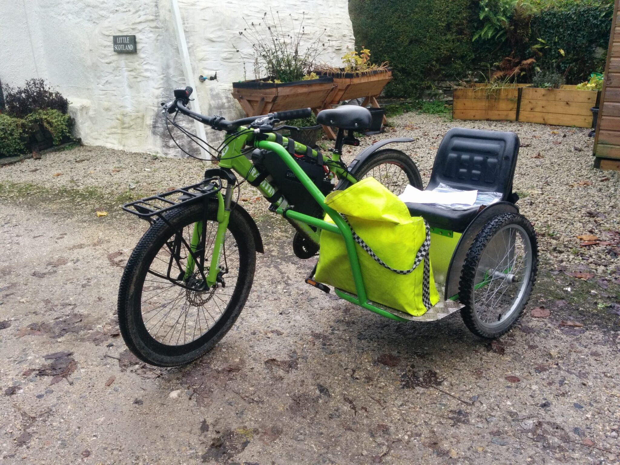 The green bike has a sidecar