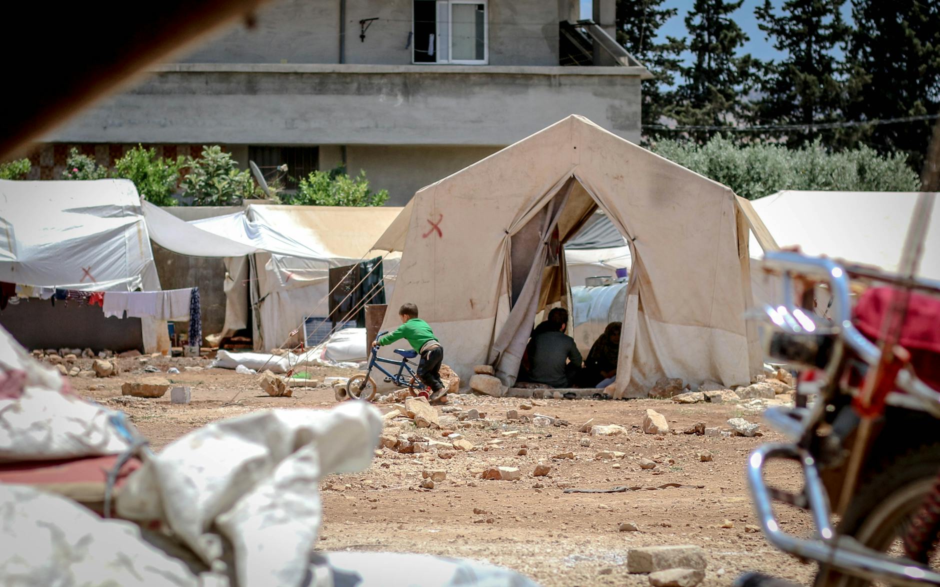 temporary tents on ground in daylight