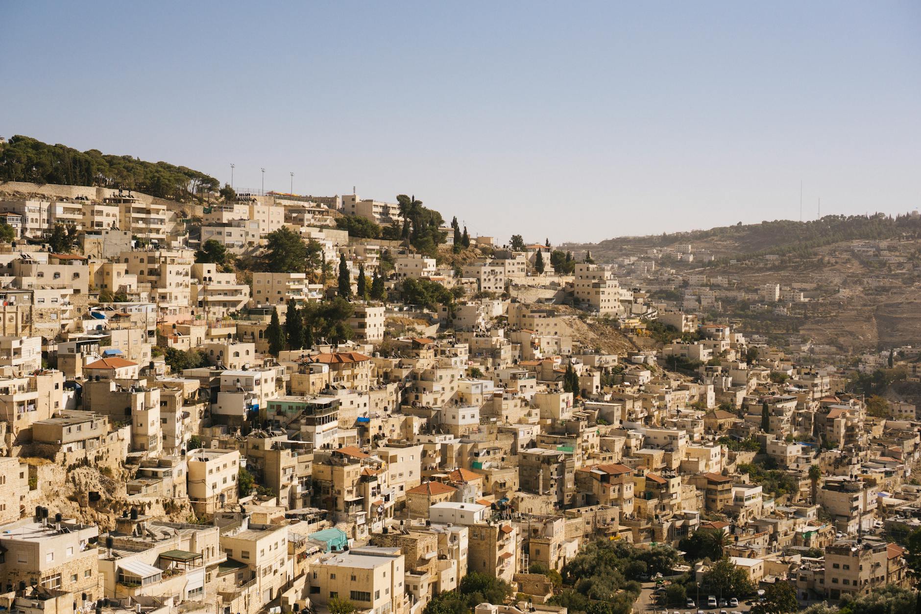 beige concrete buildings on high ground