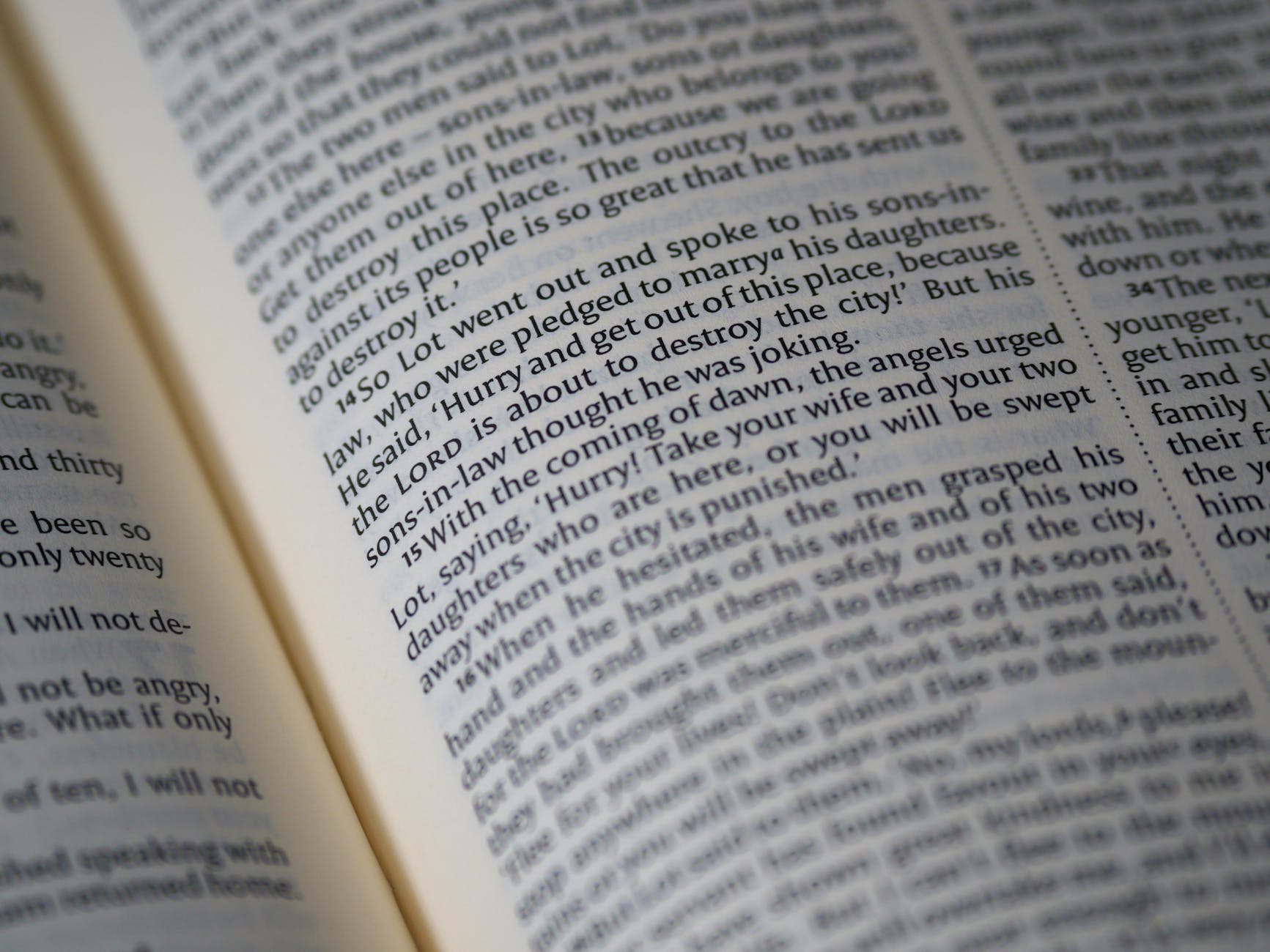 close up view of writings on a page of a holy book