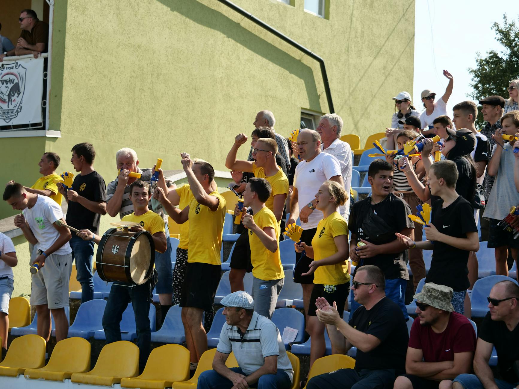 spectators on the stands cheering the team