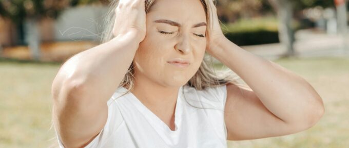 a woman holding her head